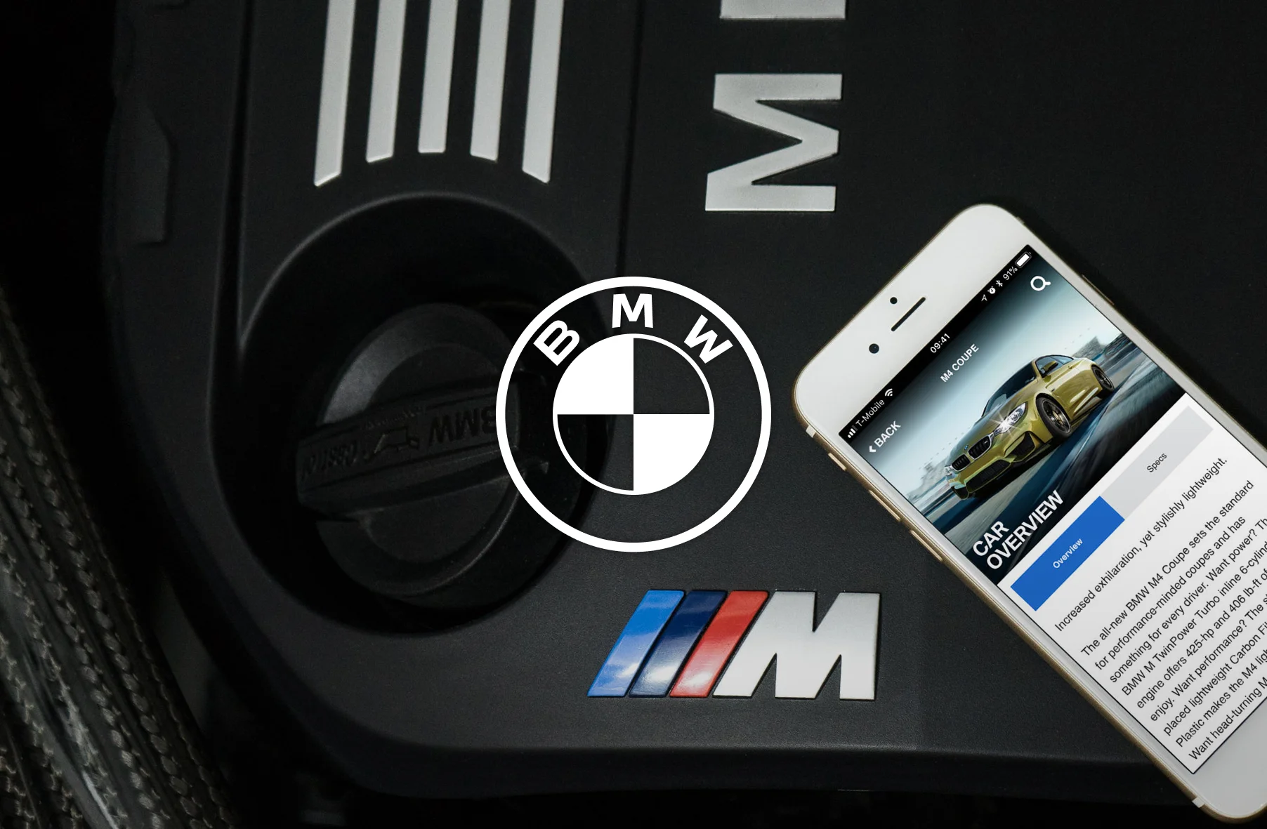iPhone with Genius app displayed sitting on a BMW M4 engine