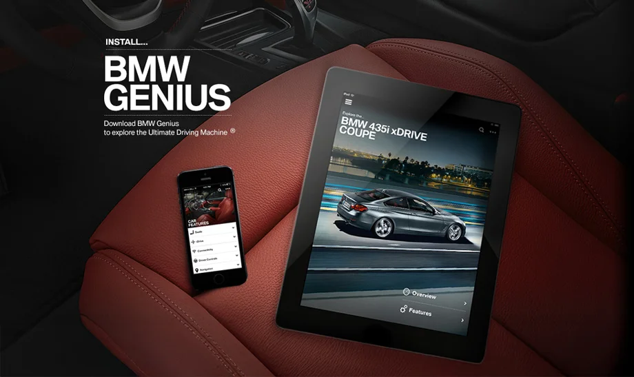 A tablet and phone sitting on a car seat with the Genius app displayed